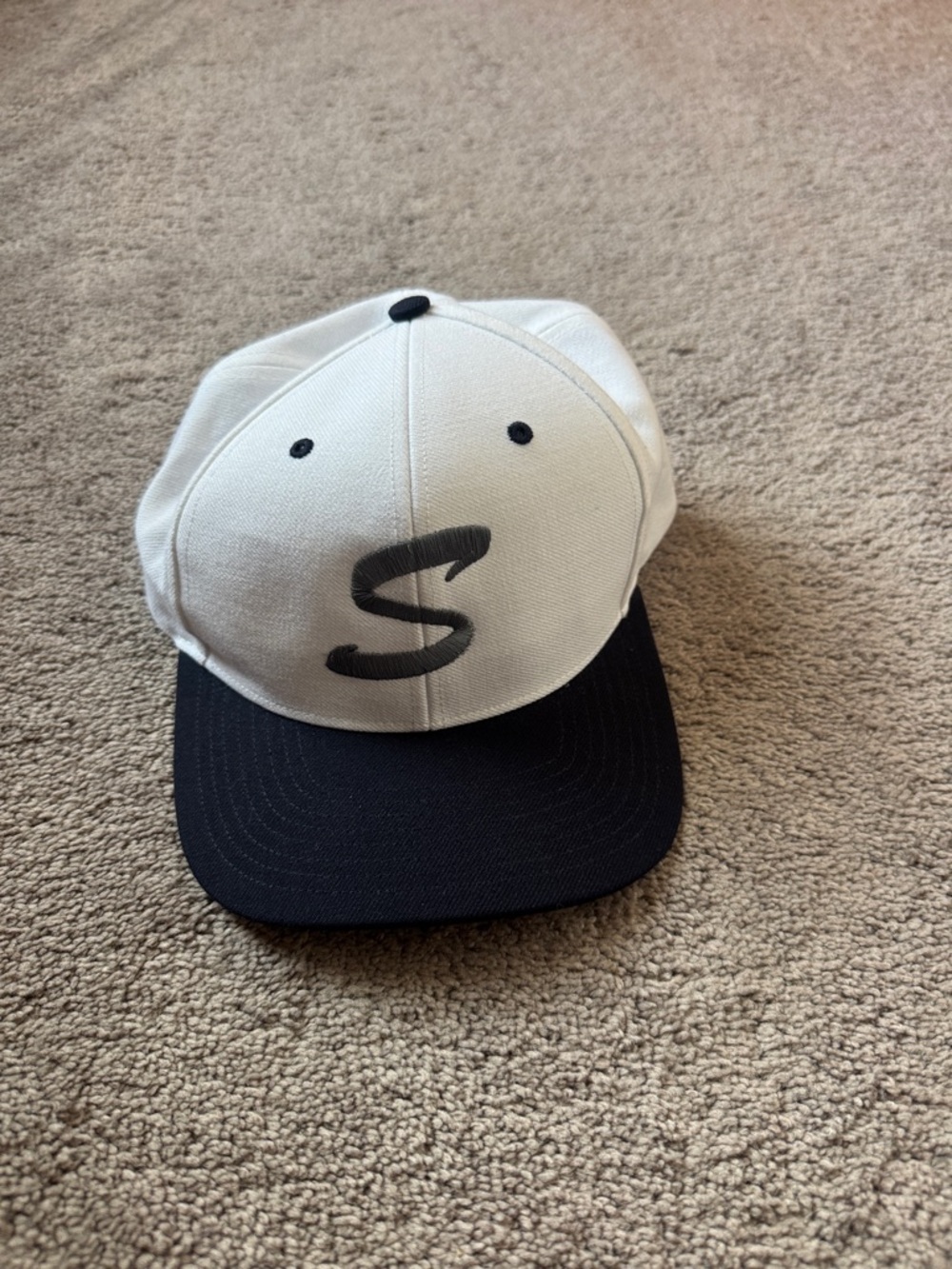 White and navy Cap with S Logo